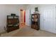 Cozy bedroom featuring a decorative cabinet, a spacious closet, and inviting natural light at 106 Madison Square Ln, Cary, NC 27513