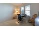 Bedroom with a window, a desk, a chair, and an antique cabinet, offering space for work and relaxation at 106 Madison Square Ln, Cary, NC 27513