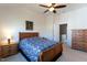 Bedroom with carpet, ceiling fan and an open door to a possible closet at 106 Madison Square Ln, Cary, NC 27513