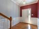 Inviting foyer with hardwood floors, crown molding, and a front door with sidelights at 106 Madison Square Ln, Cary, NC 27513