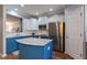 Charming kitchen showcasing an island with marble countertops and stainless steel appliances at 106 Madison Square Ln, Cary, NC 27513