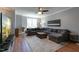 Comfortable living room featuring a large sectional sofa and neutral color palette at 106 Madison Square Ln, Cary, NC 27513