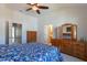 Spacious main bedroom featuring high ceilings, ceiling fan, and ensuite bathroom at 106 Madison Square Ln, Cary, NC 27513