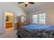Bedroom boasts high ceilings, large windows, ensuite bathroom, and neutral decor at 106 Madison Square Ln, Cary, NC 27513