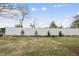 A large backyard featuring a white vinyl fence providing privacy at 108 Ripple Way # 319, Clayton, NC 27520