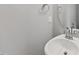 Powder room featuring a white sink, faucet and mirror on a light gray wall at 108 Ripple Way # 319, Clayton, NC 27520