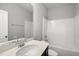A clean bathroom features a vanity with a modern sink and a shower-tub combination at 108 Ripple Way # 319, Clayton, NC 27520