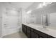 Bathroom with double sink, large mirror, walk-in shower and bath at 108 Ripple Way # 319, Clayton, NC 27520