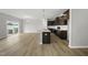 Bright, open living space features hardwood floors, large windows, and flows into the modern kitchen area at 108 Ripple Way # 319, Clayton, NC 27520