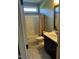 Cozy bathroom with a shower-tub combo and a vanity with a dark wood cabinet at 1101 Dovefield Ln, Youngsville, NC 27596