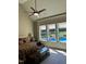 Comfortable bedroom with a vaulted ceiling, ceiling fan, and a large window looking to the pool at 1101 Dovefield Ln, Youngsville, NC 27596