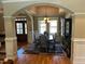 Elegant dining room featuring hardwood floors, chandelier, and classic architectural details at 1101 Dovefield Ln, Youngsville, NC 27596
