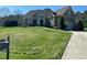 Charming home with manicured lawn, beautiful landscaping, and a welcoming front porch at 1101 Dovefield Ln, Youngsville, NC 27596
