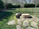 Backyard fire pit area with seating, perfect for outdoor gatherings and relaxing evenings at 1101 Dovefield Ln, Youngsville, NC 27596