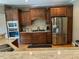 Well-equipped kitchen with stainless steel appliances, custom wood cabinets and granite countertops at 1101 Dovefield Ln, Youngsville, NC 27596