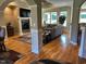Spacious living room with hardwood floors, fireplace, and abundant natural light at 1101 Dovefield Ln, Youngsville, NC 27596