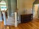 Elegant staircase with carpeted steps and wrought iron detailing, adding charm and character at 1101 Dovefield Ln, Youngsville, NC 27596