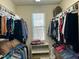 Spacious walk-in closet providing ample storage with shelving and hanging rods at 1101 Dovefield Ln, Youngsville, NC 27596
