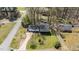Aerial view of a two-story home with mature trees and a well-maintained lawn at 1101 Driftwood Dr Dr, Siler City, NC 27344