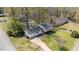 Aerial view showcasing the home's layout, landscaping, and surrounding neighborhood at 1101 Driftwood Dr Dr, Siler City, NC 27344