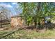 Spacious backyard with mature trees and a partially fenced yard at 1101 Driftwood Dr Dr, Siler City, NC 27344