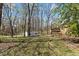 Spacious backyard with a storage shed and mature trees at 1101 Driftwood Dr Dr, Siler City, NC 27344