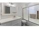 Bathroom features a white sink cabinet, toilet, and shower with art-deco inspired glass door at 1101 Driftwood Dr Dr, Siler City, NC 27344