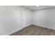 Simple bedroom design with hardwood floors, neutral paint, and a white door at 1101 Driftwood Dr Dr, Siler City, NC 27344