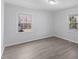 This bedroom has wood floors, white walls, and is brightly lit with natural light at 1101 Driftwood Dr Dr, Siler City, NC 27344