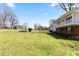 Expansive yard with a view of the two-story home and surrounding greenery at 1101 Driftwood Dr Dr, Siler City, NC 27344