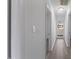 This home has a bright hallway with wood floors and neutral colored walls at 1101 Driftwood Dr Dr, Siler City, NC 27344