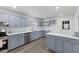 Bright kitchen features shaker cabinets, stainless appliances, and white countertops at 1101 Driftwood Dr Dr, Siler City, NC 27344