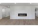 Modern living room features an electric fireplace and light wood floors at 1101 Driftwood Dr Dr, Siler City, NC 27344