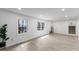 Open living room boasts natural light, hardwood floors, and neutral paint at 1101 Driftwood Dr Dr, Siler City, NC 27344
