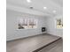 Bright living room features gray wood flooring, white walls, and updated lighting fixtures at 1101 Driftwood Dr Dr, Siler City, NC 27344