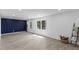 Spacious living room with hardwood floors, large windows, and a blue accent wall at 1101 Driftwood Dr Dr, Siler City, NC 27344