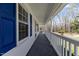Covered porch with ample space and scenic views of the surrounding landscape at 1101 Driftwood Dr Dr, Siler City, NC 27344