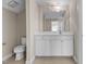 This well-lit bathroom has a white vanity with a large mirror and ample counter space at 1159 Blue Bird Ln, Wake Forest, NC 27587