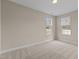 This bedroom has neutral walls, carpet and two windows to let in natural light at 1159 Blue Bird Ln, Wake Forest, NC 27587