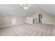 This versatile bonus room includes a ceiling fan and carpet at 1159 Blue Bird Ln, Wake Forest, NC 27587