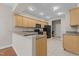 Well-lit kitchen offering ample counter space, tiled floor, and modern appliances in a neutral color palette at 1159 Blue Bird Ln, Wake Forest, NC 27587