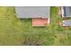 Aerial view of back of a home featuring a deck and well-maintained lawn at 118 Tysor Cir, Graham, NC 27253
