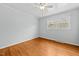 Light filled bedroom with hardwood floors, ceiling fan and neutral walls at 118 Tysor Cir, Graham, NC 27253