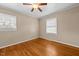 Bedroom with hardwood floors, ceiling fan, and neutral colored walls at 118 Tysor Cir, Graham, NC 27253