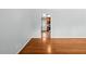 Spacious living room with beautiful hardwood floors leading to another room at 118 Tysor Cir, Graham, NC 27253