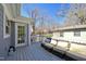 Outdoor deck featuring wicker furniture and a serene view, perfect for relaxation and entertaining at 1213 Lincoln St, Durham, NC 27701