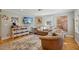 Comfortable living room featuring hardwood floors, a plush sofa, and tasteful decor at 1213 Lincoln St, Durham, NC 27701