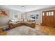 Cozy living room with hardwood floors, a comfortable couch and lots of natural light at 1213 Lincoln St, Durham, NC 27701