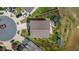 An aerial view of a home highlighting the roof, backyard entertainment features, and landscaping at 1295 Kerr St, Burlington, NC 27215