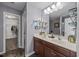 Bathroom featuring a double vanity and closet with ample storage at 1295 Kerr St, Burlington, NC 27215